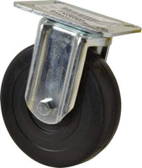 E.R. Wagner - 5" Diam x 1-3/8" Wide x 6-1/16" OAH Top Plate Mount Rigid Caster - Soft Rubber, 240 Lb Capacity, Delrin Bearing, 3-1/8 x 4-1/8" Plate - Benchmark Tooling