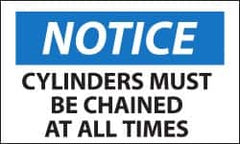 NMC - Accident Prevention Label, Header: NOTICE - Legend: Notice - Cylinders Must Be Chained at All Times, English, Black, Blue & White, 5" Long x 3" High, Sign Muscle Finish - Benchmark Tooling