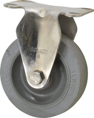 Albion - 4" Diam x 1-1/4" Wide x 5-1/8" OAH Top Plate Mount Rigid Caster - Soft Rubber, 410 Lb Capacity, Delrin Bearing, 2-1/2 x 3-5/8" Plate - Benchmark Tooling