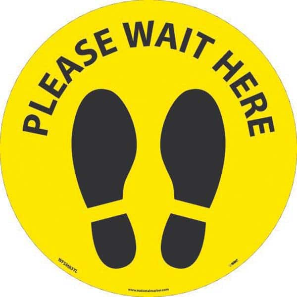 Adhesive Backed Floor Signs; Message Type: COVID-19; Graphic Type: Shoeprints; Message or Graphic: Message & Graphic; Legend: Please Wait Here; Color: Yellow; Black; Special Color Properties: No Special Properties; Material: Vinyl; Shape: Circle; Oval; La