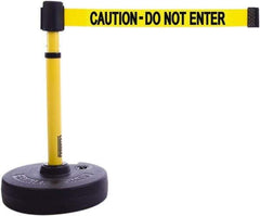 Banner Stakes - 22 to 42" High, 2-3/8" Pole Diam, Barrier Post Base & Stanchion - 9" Base Diam, Round Nylon Base, Yellow Plastic Post, 15' x 2-1/2" Tape, For Outdoor Use - Benchmark Tooling