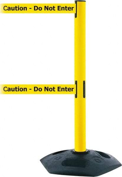 Tensator - 38" High, 2-1/2" Pole Diam, 4 Way Stanchion - 19" Base Diam, Octagon Recycled Rubber Base, Yellow Plastic Post, 13' x 2" Tape, Dual Line Tape, For Outdoor Use - Benchmark Tooling