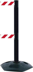 Tensator - 38" High, 2-1/2" Pole Diam, 4 Way Stanchion - 19" Base Diam, Octagon Recycled Rubber Base, Black Plastic Post, 7-1/2' x 2" Tape, Dual Line Tape, For Outdoor Use - Benchmark Tooling