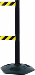 Tensator - 38" High, 2-1/2" Pole Diam, 4 Way Stanchion - 19" Base Diam, Octagon Recycled Rubber Base, Black Plastic Post, 13' x 2" Tape, Dual Line Tape, For Outdoor Use - Benchmark Tooling