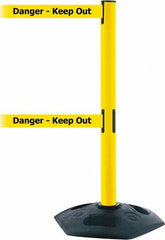 Tensator - 38" High, 2-1/2" Pole Diam, 4 Way Stanchion - 19" Base Diam, Octagon Recycled Rubber Base, Yellow Plastic Post, 7-1/2' x 2" Tape, Dual Line Tape, For Outdoor Use - Benchmark Tooling