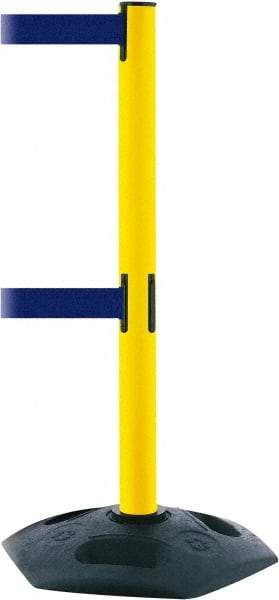 Tensator - 38" High, 2-1/2" Pole Diam, 4 Way Stanchion - 19" Base Diam, Octagon Recycled Rubber Base, Yellow Plastic Post, 7-1/2' x 2" Tape, Dual Line Tape, For Outdoor Use - Benchmark Tooling