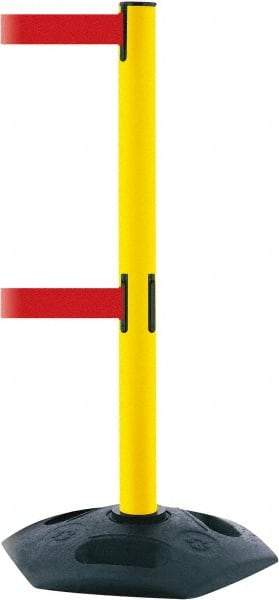 Tensator - 38" High, 2-1/2" Pole Diam, 4 Way Stanchion - 19" Base Diam, Octagon Recycled Rubber Base, Yellow Plastic Post, 7-1/2' x 2" Tape, Dual Line Tape, For Outdoor Use - Benchmark Tooling