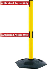 Tensator - 38" High, 2-1/2" Pole Diam, 4 Way Stanchion - 19" Base Diam, Octagon Recycled Rubber Base, Yellow Plastic Post, 13' x 2" Tape, Dual Line Tape, For Outdoor Use - Benchmark Tooling