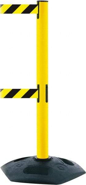 Tensator - 38" High, 2-1/2" Pole Diam, 4 Way Stanchion - 19" Base Diam, Octagon Recycled Rubber Base, Yellow Plastic Post, 13' x 2" Tape, Dual Line Tape, For Outdoor Use - Benchmark Tooling