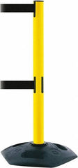 Tensator - 38" High, 2-1/2" Pole Diam, 4 Way Stanchion - 19" Base Diam, Octagon Recycled Rubber Base, Yellow Plastic Post, 13' x 2" Tape, Dual Line Tape, For Outdoor Use - Benchmark Tooling