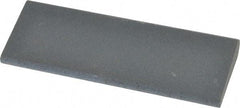 Norton - 4-1/2" Long x 1-3/4" Diam x 1/2" Thick, Silicon Carbide Sharpening Stone - Round, Fine Grade - Benchmark Tooling