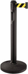 Lavi Industries - 38-1/4" High, 3-1/4" Pole Diam, Stanchion - 16" Base Diam, Dome Recycled Rubber Base, Black Plastic Post, 12' x 2" Tape, Single Line Tape, For Outdoor Use - Benchmark Tooling