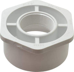 Value Collection - 4 x 2" PVC Plastic Pipe Bushing - Schedule 40, Spig x FIPT End Connections - Benchmark Tooling