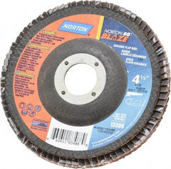 Norton - 60 Grit, 4-1/2" Disc Diam, 7/8" Center Hole, Type 29 Ceramic Flap Disc - 13,000 Max RPM, Fiberglass Backing, Arbor Attaching System, Coated - Benchmark Tooling